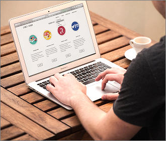 Man browsing a website on his laptop